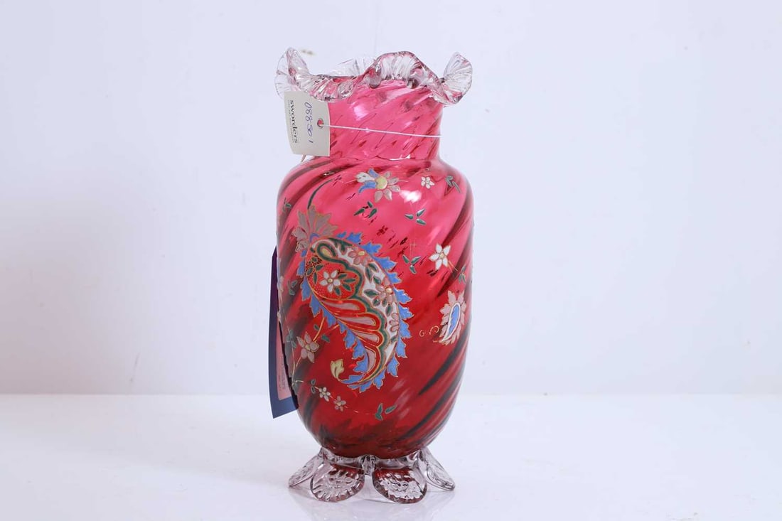 A cranberry glass vase, 19th century,: A cranberry glass vase, 19th century, with fluted edge and base, with painted floral decoration 14cm wide, 30cm high Condition Report: One chip the base. Some minor scratches and chips to the