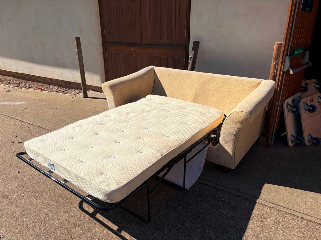 A two seater sofa bed, of recent manufacture, - 3