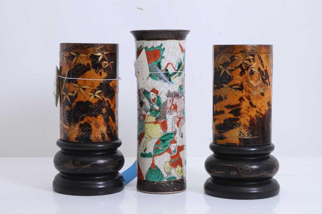 A pair of tortoiseshell veneered vases, Japanese, 19th century,: A pair of tortoiseshell veneered vases, Japanese, 19th century, each decorated with cranes and bamboo, raised on knopped and lacquered circular wood stands, together with a crackle-glazed sleeve
