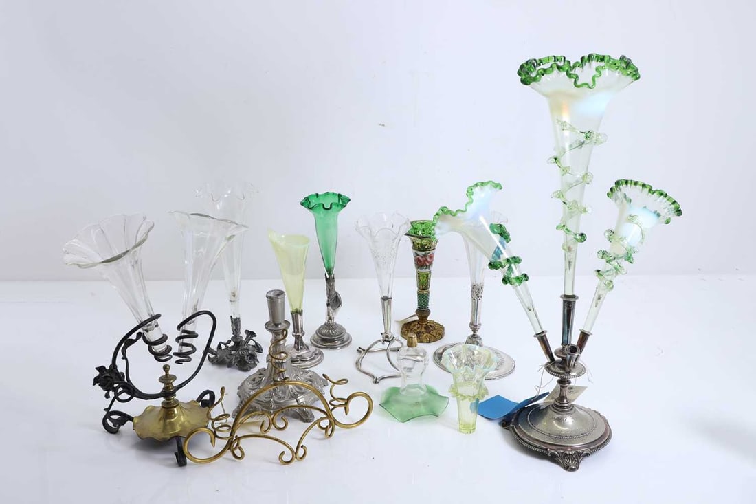 A collection of epergnes, 20th century and later,: A collection of epergnes, 20th century and later, to include a vaseline glass example with green frilled line decoration, various mounts, green uranium glass examples, etc The largest, 50cm high 