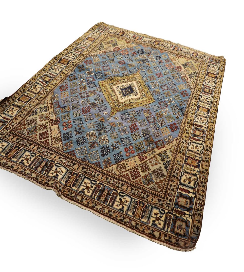 A North West Persian Josheghan carpet,: A North West Persian Josheghan carpet, the sky-blue field centred by a stepped lozenge medallion in ivory, indigo and olive, surrounded by an all-over arrangement of stylised geometric floral