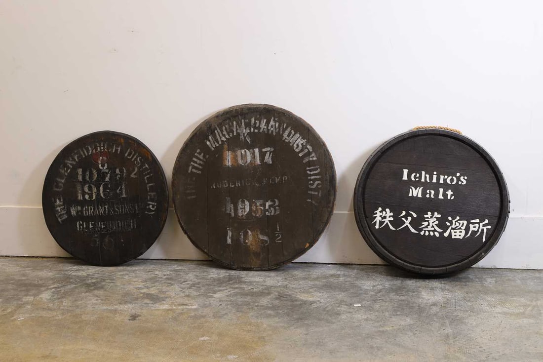 A group of three whisky barrel tops, 20th century, - 2