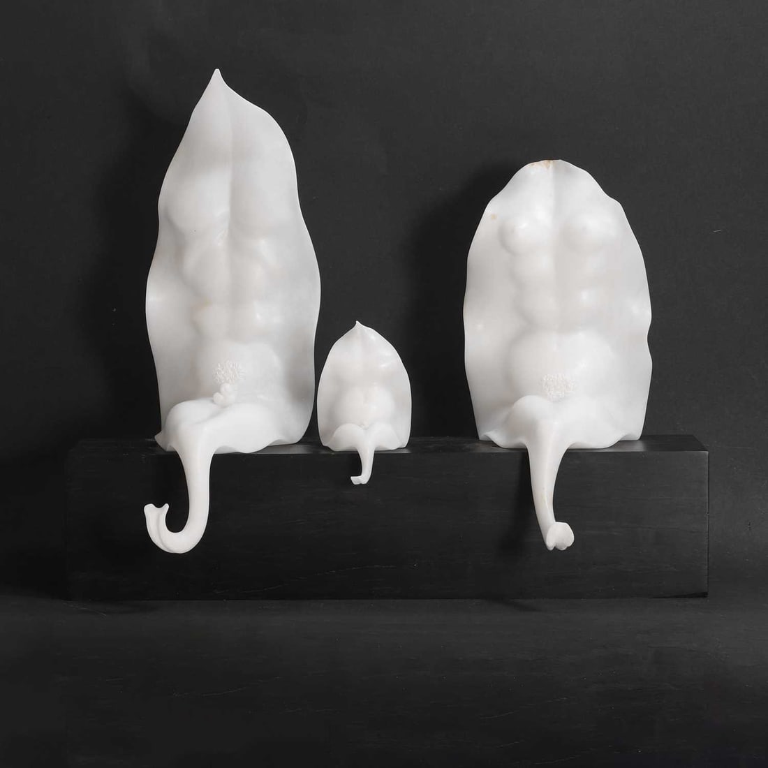 Paolo Sabatini (Italian, b.1942),: Paolo Sabatini (Italian, b.1942), 'Famiglia di Foglie', three carved alabaster nude figures, on a wood plinth, 41cm wide, 33cm high Condition Report: Chips and nibbles to the edges.