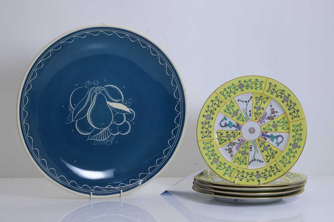 Five Herend yellow glazed plates,: Five Herend yellow glazed plates, with yellow ground and the main field decorated with trees, with blue stamped mark to the base, together with a Suzie Cooper charger, decorated with pears and