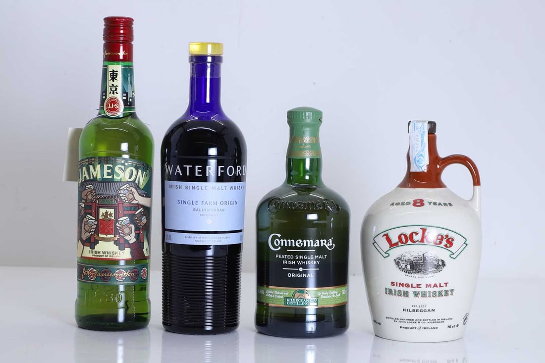 A selection of Irish whiskies,: A selection of Irish whiskies, assorted makers and types, as per photographs (4 bottles in total)Shipping Disclaimer: Please note we cannot guarantee condition of contents or quality of storage. No