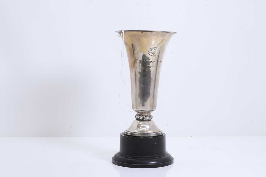 A silver presentation vase, 'The Hendon Vase, 1939': A silver presentation vase, 'The Hendon Vase, 1939' by Charles Boyton, London 1939, of flared trumpet form, the body engraved with a profile of a greyhound above the inscription 'THE HENDON VASE