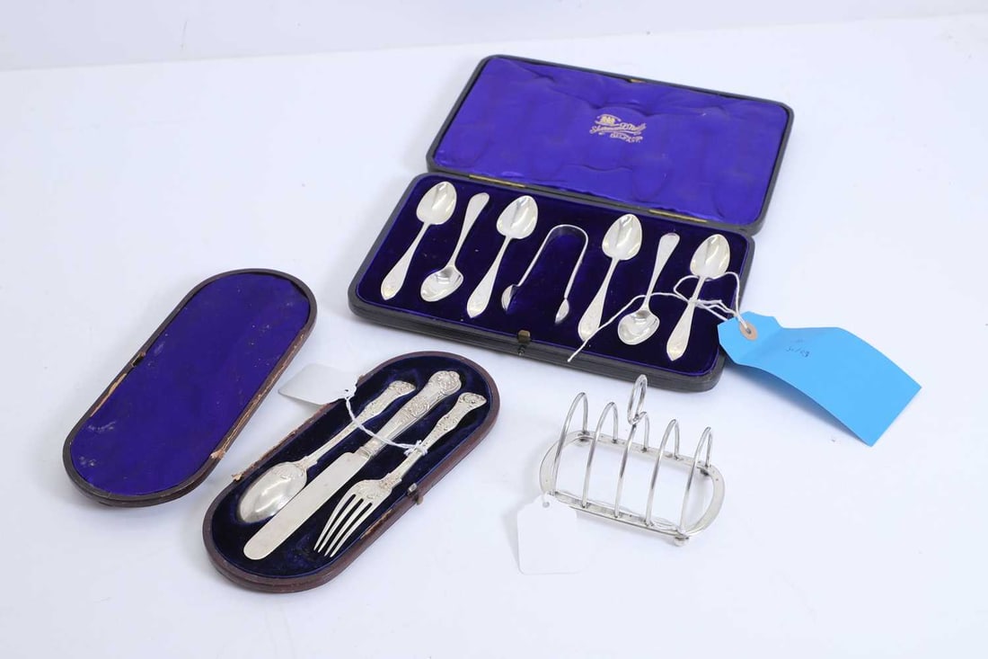 A collection of silver items: A collection of silver items comprising a set of six teaspoons and a pair of sugar tongs, by Sharman D Neill, Dublin 1933, each with bright cut decoration engraved 'B' to the handles, presented in