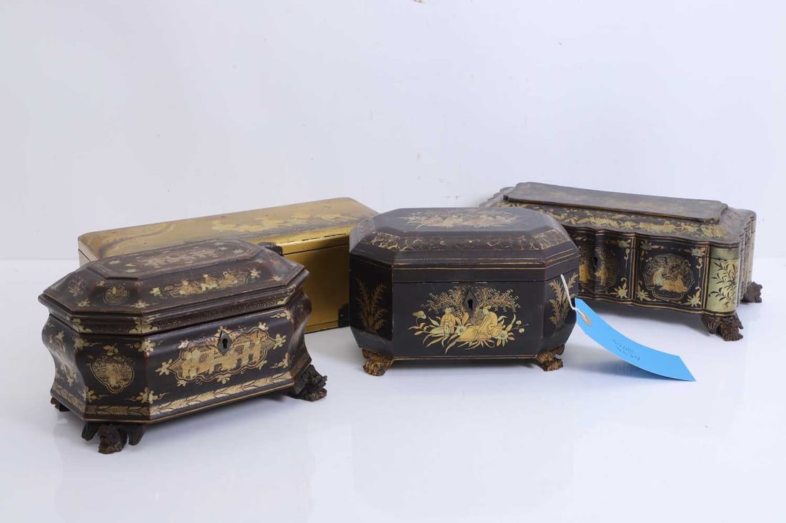 Three Chinese export gilt lacquered boxes, 19th century,: Three Chinese export gilt lacquered boxes, 19th century, each of shaped rectangular form, and typically decorated with gilt figures, flowering foliage, terminating on mythical beast or paw feet, one