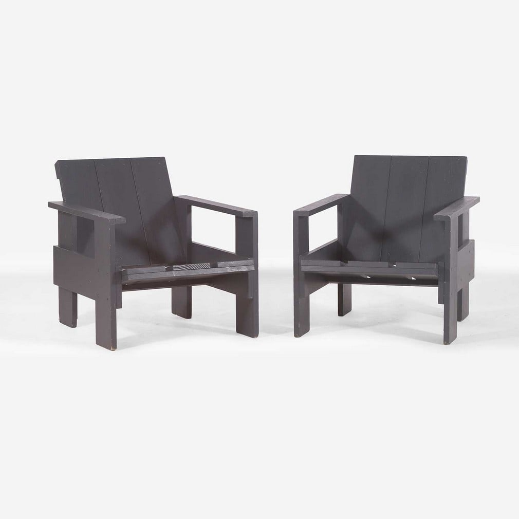 After Gerrit Rietveld, a pair of 'Crate' chairs,: After Gerrit Rietveld, a pair of 'Crate' chairs, originally designed in 1934, of recent manufacture, each constructed from Douglas fir wood panels, painted in a dark blue-grey tone (58cm wide, 78cm de