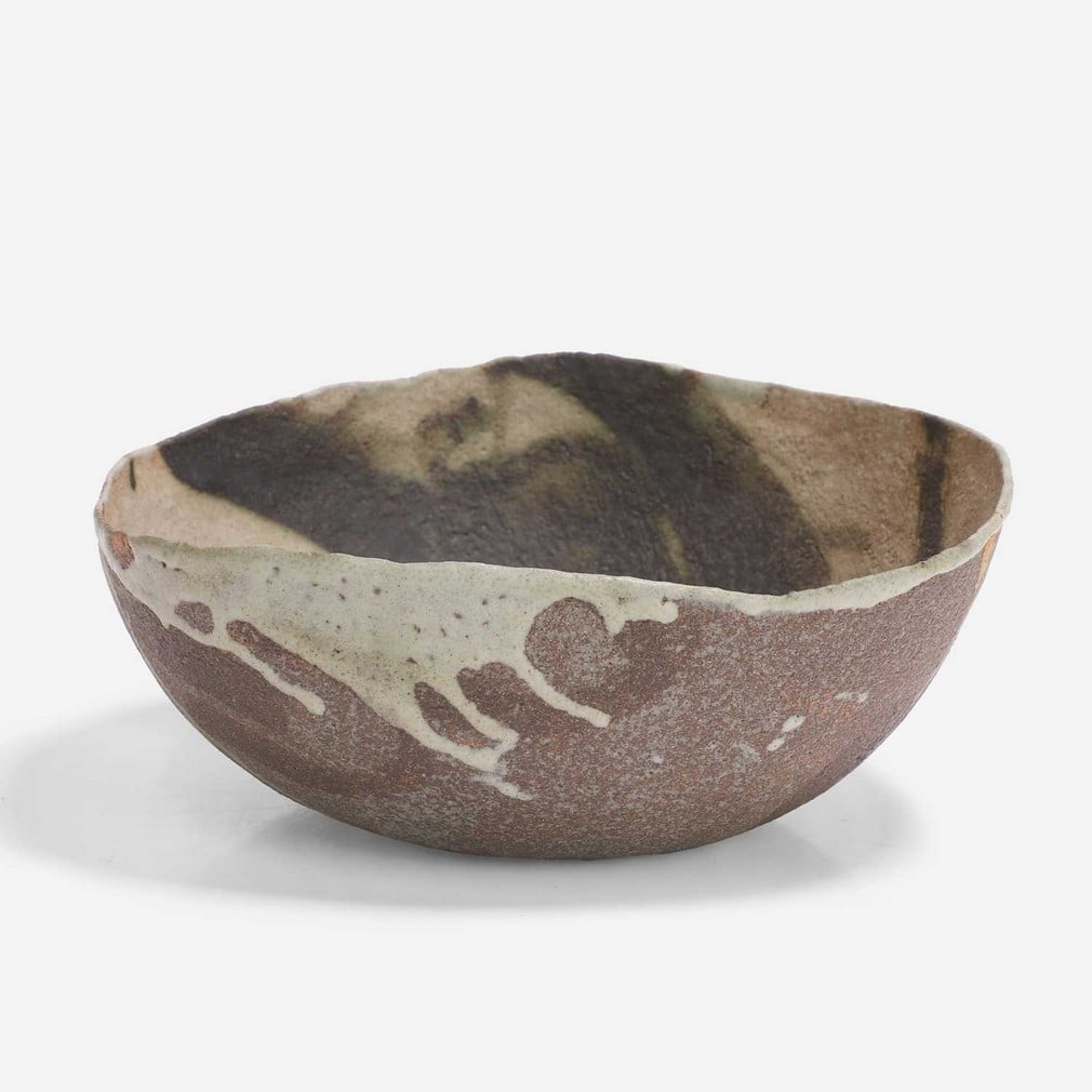 ▲ Ewen Henderson (British, 1934-2000), an 'Early Bowl',: ▲ Ewen Henderson (British, 1934-2000), an 'Early Bowl', circa 1976, stoneware and porcelain, mixed laminated clays, the enclosed form with black-painted glaze on a white-dripped interior with vo