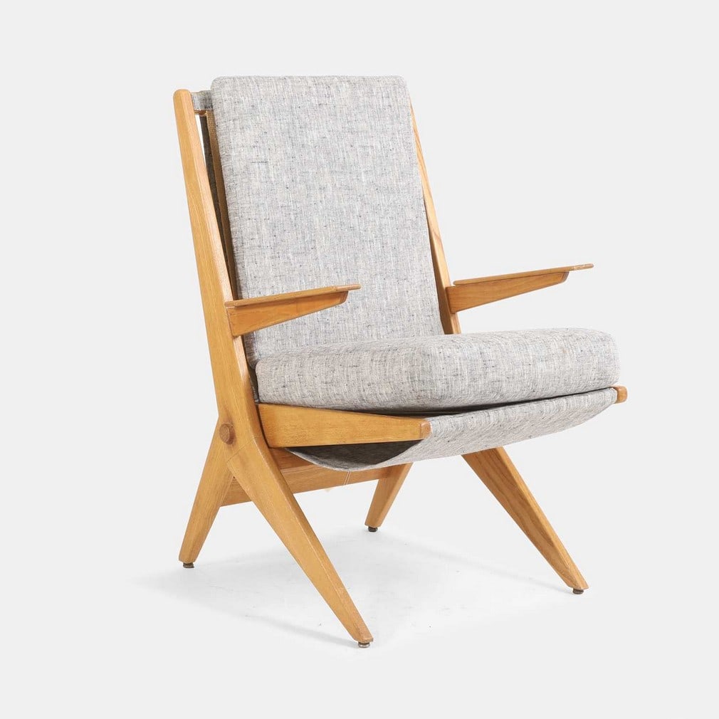 Dutch, a folding chair,: Dutch, a folding chair, circa 1950s-60s, the oak frame with grey flecked fabric upholstery (60cm wide, 65cm deep, 91cm high, 50cm to seat)
