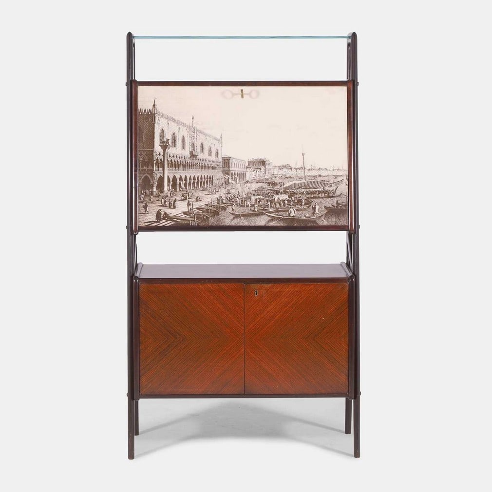 Vittorio Dassi (Italian, 1893-1973), a mahogany drinks cabinet,: Vittorio Dassi (Italian, 1893-1973), a mahogany drinks cabinet, circa 1950s, the glass shelf over a suspended cupboard, the door printed with a scene depicting the Doge's palace in Venice, opening to