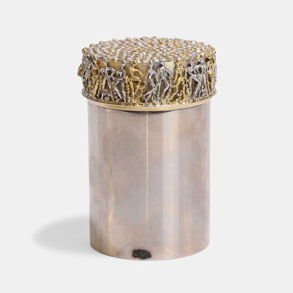 ▲ Stuart Devlin (Australian-British, 1931-2018), a silver and silver-gilt cigarette box and: ▲ Stuart Devlin (Australian-British, 1931-2018), a silver and silver-gilt cigarette box and cover, London, 1973, of cylindrical form, the main body in polished silver, the silver-gilt cover with