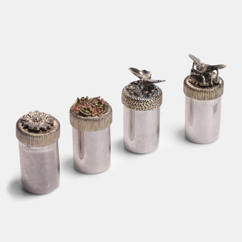 Stuart Devlin (Australian-British, 1931-2018), a group of four small silver and silver-gilt pots and: Stuart Devlin (Australian-British, 1931-2018), a group of four small silver and silver-gilt pots and covers, comprising one example dated London, 1978, another, 1979, and two further, 1981, of cylindr