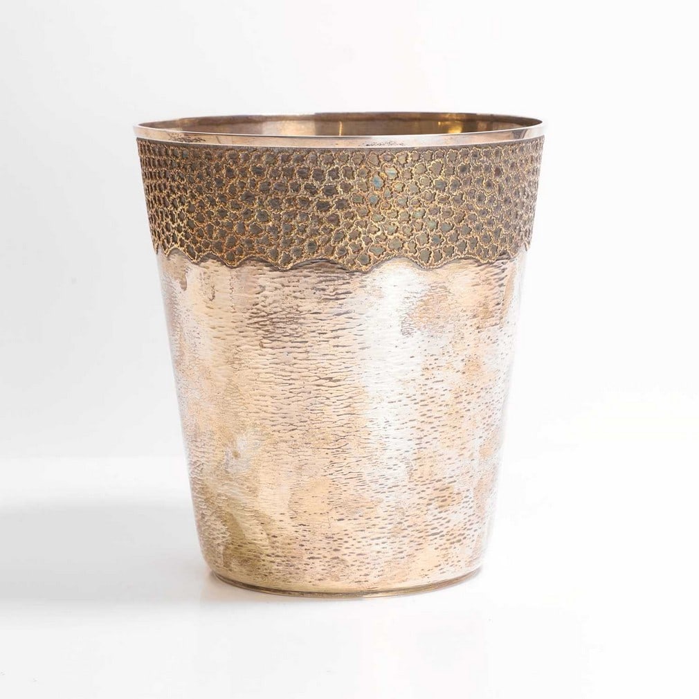 ▲ Stuart Devlin (Australian-British, 1931-2018), a silver and silver-gilt champagne bucket,: ▲ Stuart Devlin (Australian-British, 1931-2018), a silver and silver-gilt champagne bucket, London, 1973, with a planished silver body and a silver-gilt filigree upper band with a wavy border (2
