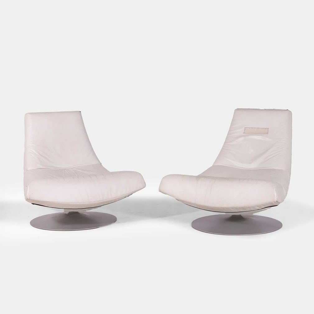 After Gijs Papavoine, a pair of 'Montis Olivier' swivel chairs,: After Gijs Papavoine, a pair of 'Montis Olivier' swivel chairs, of recent manufacture, each of white leather on a chrome pedestal foot (94cm wide, 74cm deep, 86cm high, 42cm to seat) (2)