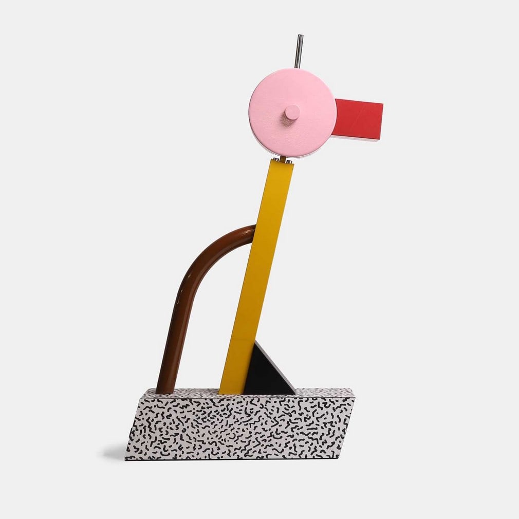 Ettore Sottsass (Italian, 1917-2007) for Memphis, a 'Tahiti' table lamp,: Ettore Sottsass (Italian, 1917-2007) for Memphis, a 'Tahiti' table lamp, 1981, enamelled metal and printed laminates, with applied manufacturer's plaque (10cm wide, 36cm deep, 69.5cm high)