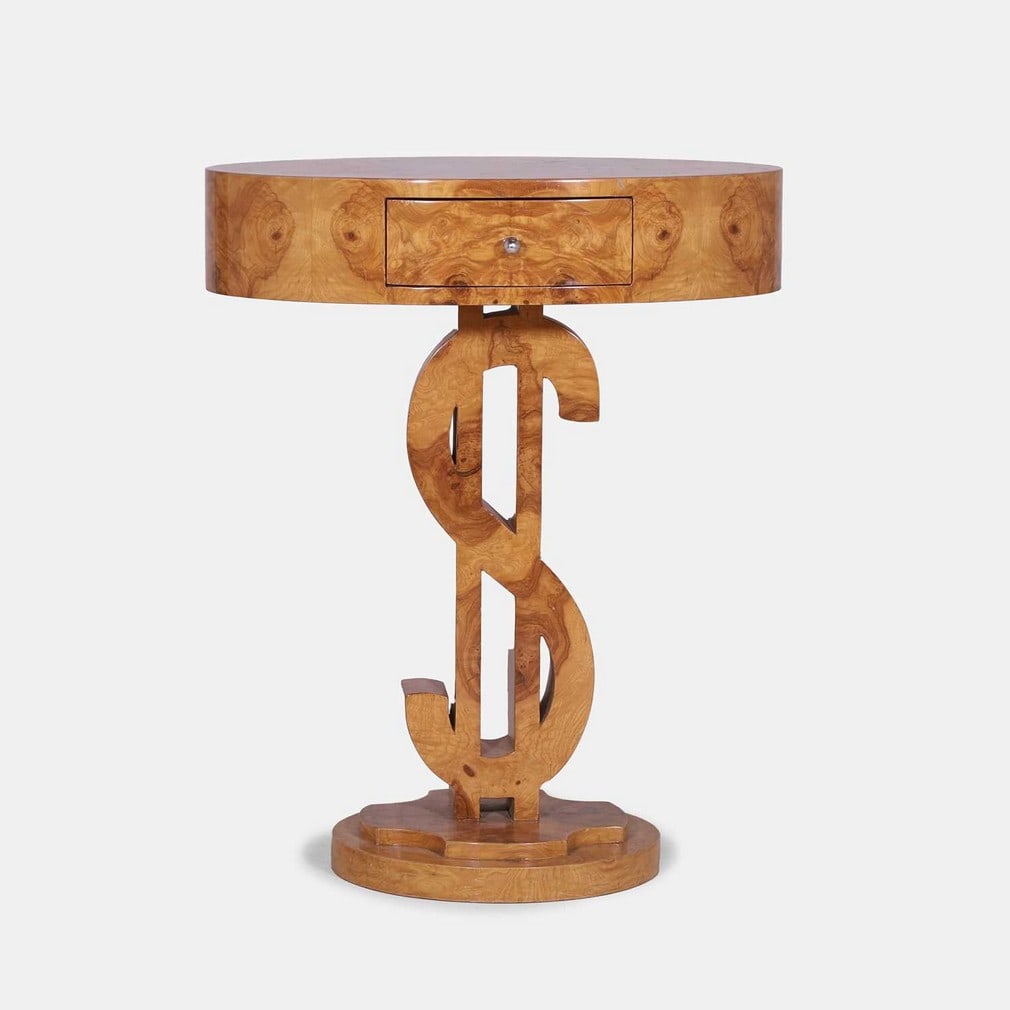 Art Deco style, an ash side table,: Art Deco style, an ash side table, circa 1980, the oval top with a single drawer, over a carved support modelled as a dollar sign, raised on a stepped circular plinth (67cm wide, 49cm deep, 84cm high)