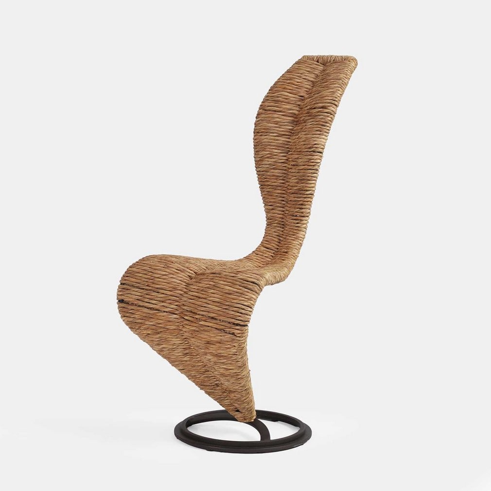 Tom Dixon (b.1959) for Cappellini, an 'S' chair,: Tom Dixon (b.1959) for Cappellini, an 'S' chair, of recent manufacture, the dark lacquered-metal frame covered in woven straw, stamped 'Cappellini' to the base (49cm wide, 48cm deep, 101cm high)