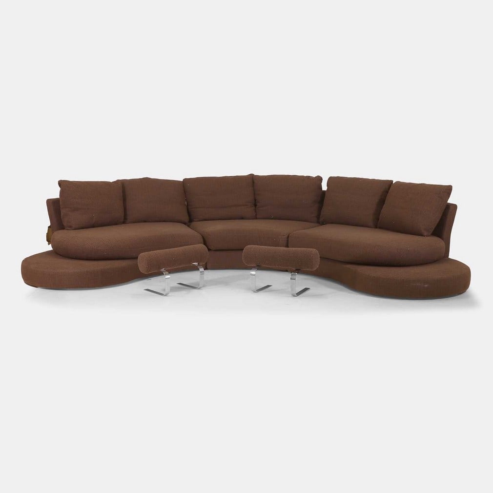 Roche Bobois, a 'Formentera' sofa,: Roche Bobois, a 'Formentera' sofa, with brown upholstery, together with two footstools with brown upholstery and raised on chrome bases, with applied manufacturer's label (358cm wide, 180cm deep,