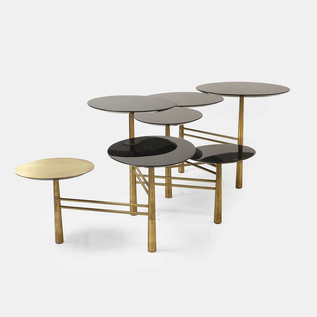 Nada Debs, a 'Pebble' coffee table,: Nada Debs, a 'Pebble' coffee table, of recent manufacture, the lacquer wooden tops on an adjustable angled brass frame (140cm wide, 80cm deep, 52cm high)