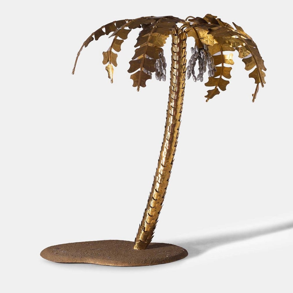 After Jacques Duval-Brasseur, a Hollywood Regency floor lamp,: After Jacques Duval-Brasseur, a Hollywood Regency floor lamp, second half of the 20th century, in the form of a palm tree, patinated and gilt-metal with seven palms, raised on a faux turf base (169cm