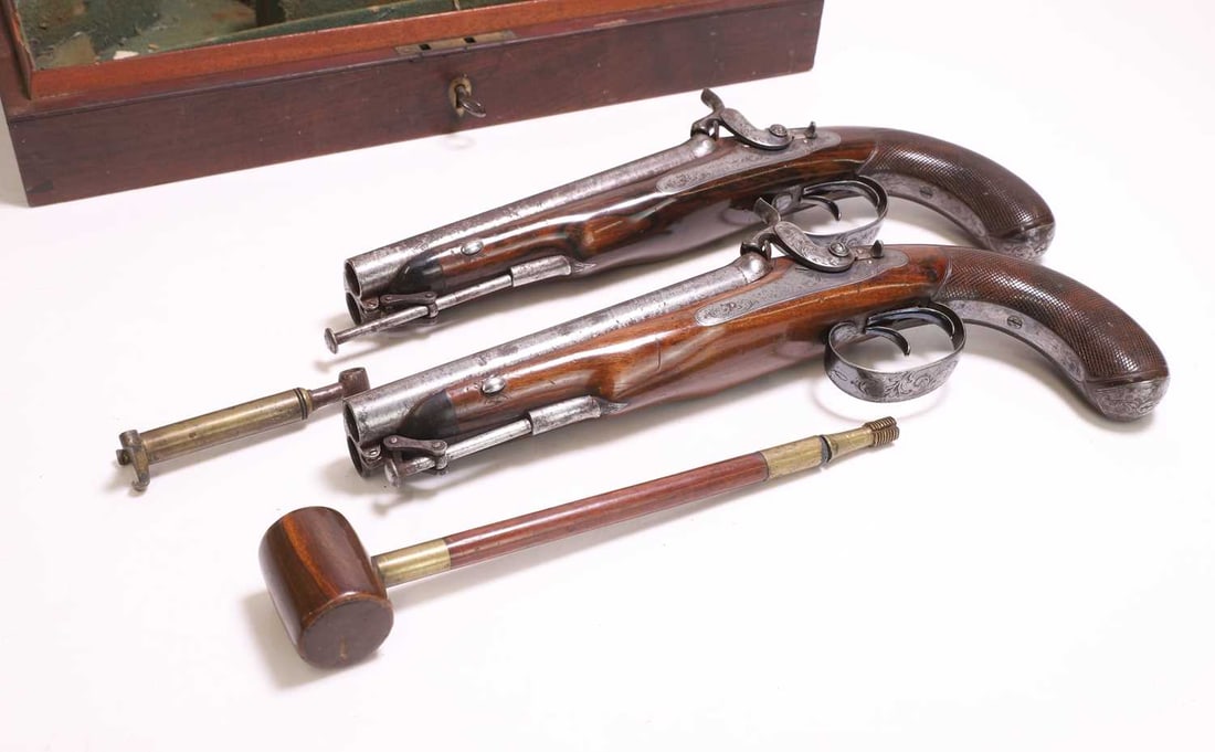 A pair of Charles Moore patent cased double-barrelled percussion pistols, c.1830, - 2