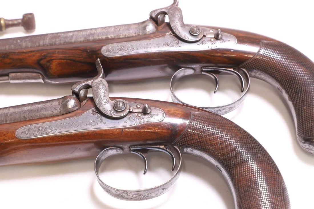 A pair of Charles Moore patent cased double-barrelled percussion pistols, c.1830, - 3