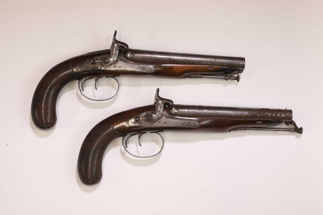 A pair of Charles Moore patent cased double-barrelled percussion pistols, c.1830, - 4