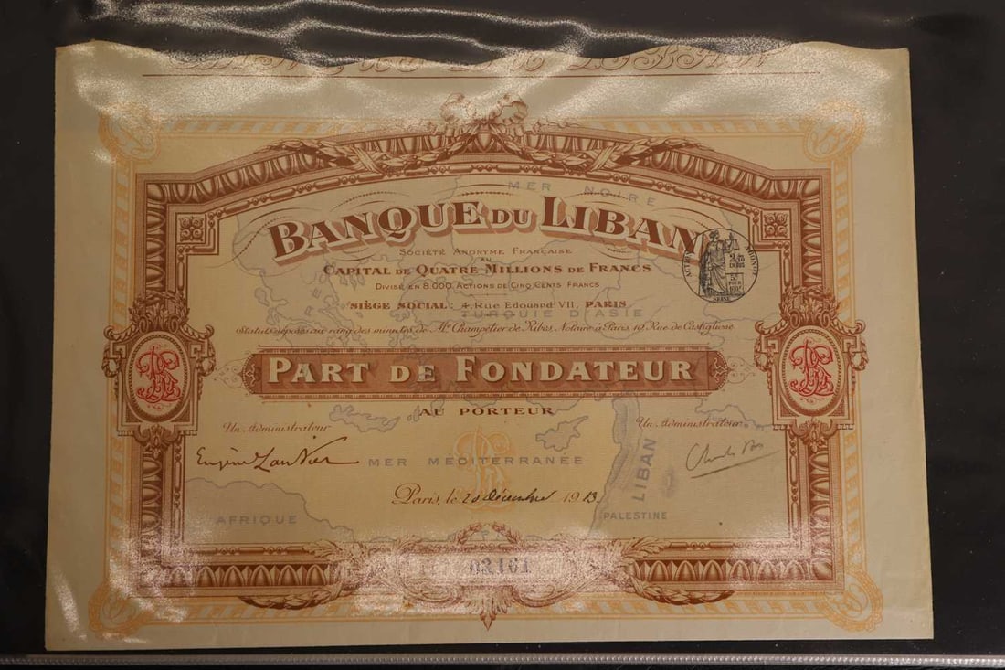 A collection of share certificates, - 2