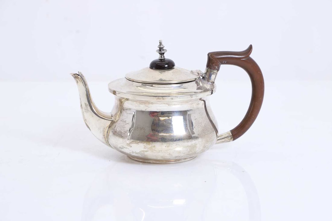 A silver three piece tea set, - 2