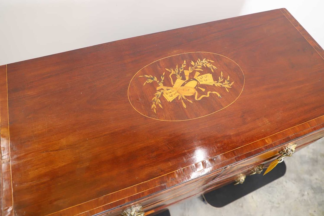 A mahogany and boxwood inlaid chest of four drawers, 20th century, - 2