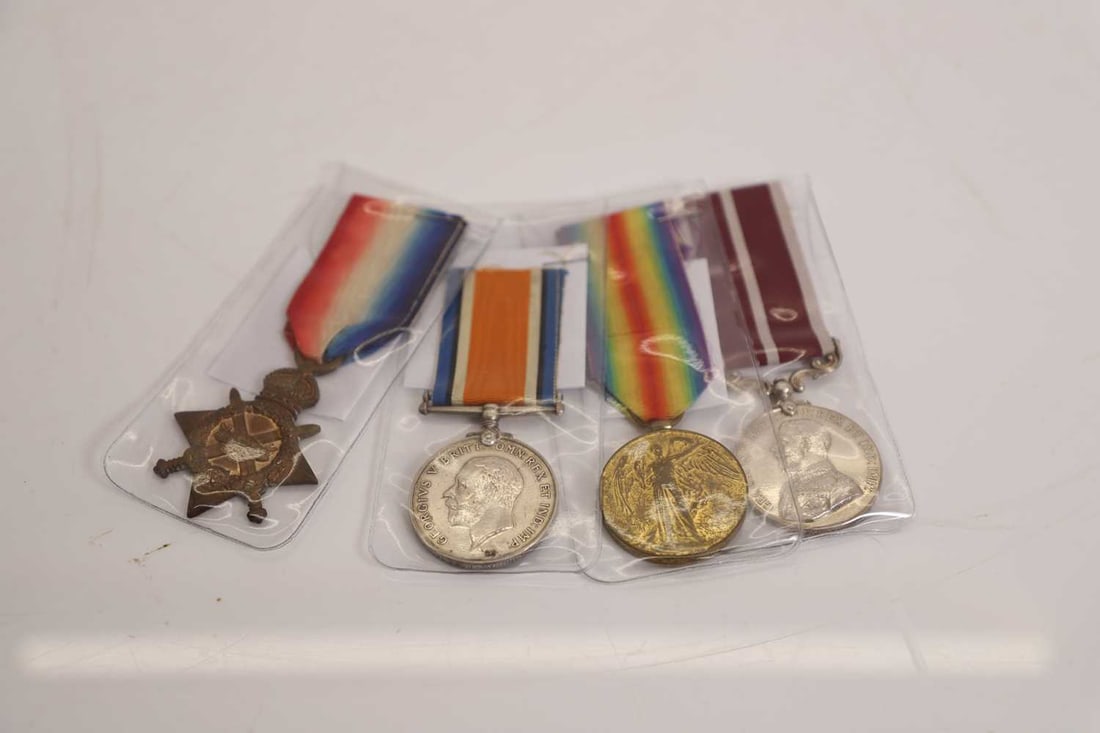 A group of four First World War Medals W J Symonds: A group of four First World War Medals W J Symonds comprising the 1914–15 star, the British War Medal and Victory Medal, and a further George V service medal, each suspended from its respective