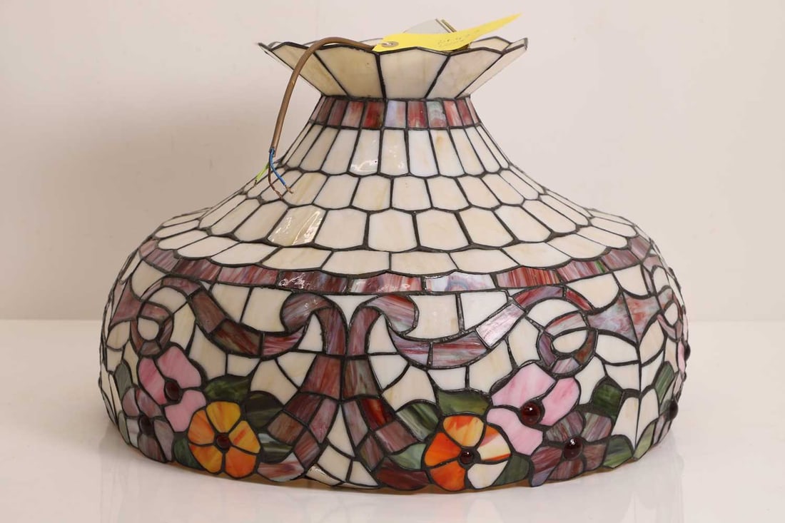 A stained glass style shade, or recent manufacture,: A stained glass style shade, or recent manufacture, resin, decorated with pink flowers and ribbon swags 50cm diameter, 35cm highCondition Report: Some slight marks and scratches to the surface. Plast
