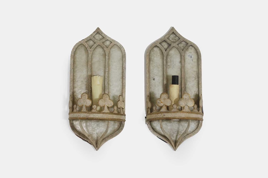 A pair of Gothic-style painted metal wall lights, of recent manufacture, by Niermann Weeks,: A pair of Gothic-style painted metal wall lights, of recent manufacture, by Niermann Weeks, each with a backplate surmounted by an ogee three-centred arch over blind fretwork panels, supporting a sin