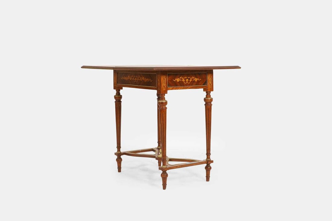 A Louis XVI-style walnut, marquetry and penwork games table, first half of the 20th century, French, - 2