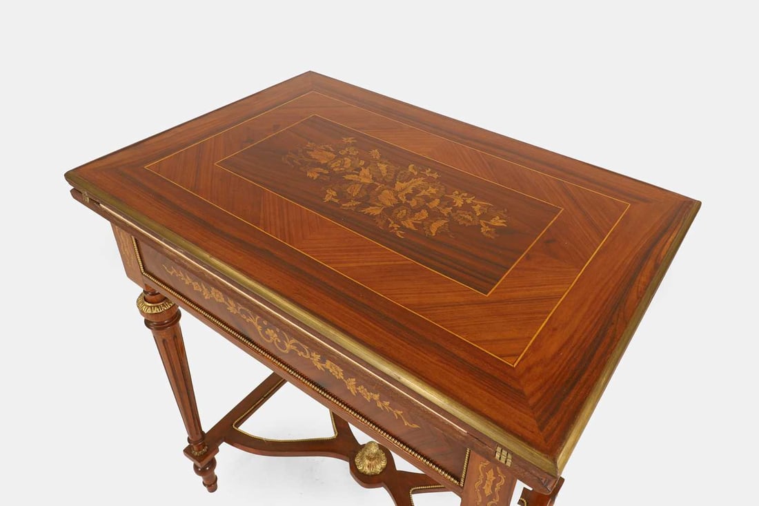 A Louis XVI-style walnut, marquetry and penwork games table, first half of the 20th century, French, - 5