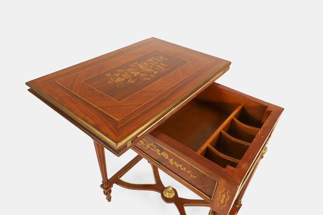A Louis XVI-style walnut, marquetry and penwork games table, first half of the 20th century, French, - 6