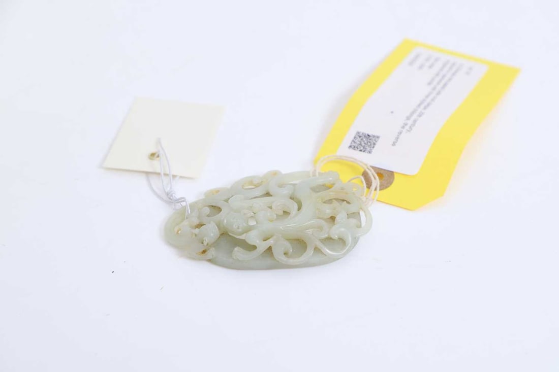 A Chinese reticulated jade oval plaque, 20th century, - 2