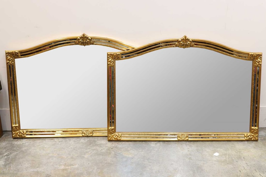 A pair of modern gilt and multi panel mirrors, of recent manufacture,: A pair of modern gilt and multi panel mirrors, of recent manufacture, each with arched crestings, 89 x 126cm 2Condition Report: Good overall