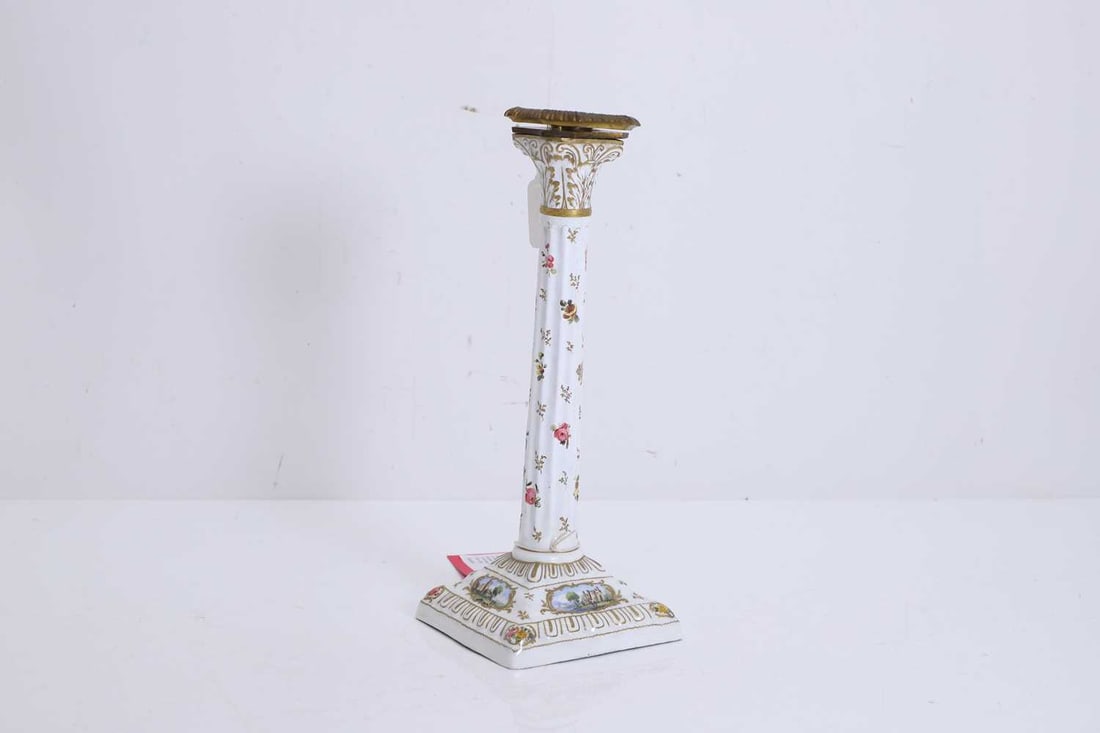 A South Staffordshire enamelled candlestick, late 18th century, Bilston,: A South Staffordshire enamelled candlestick, late 18th century, Bilston, of Corinthian column form, painted all over with floral sprays and decorated with Italianate landscape panels, and a moulded