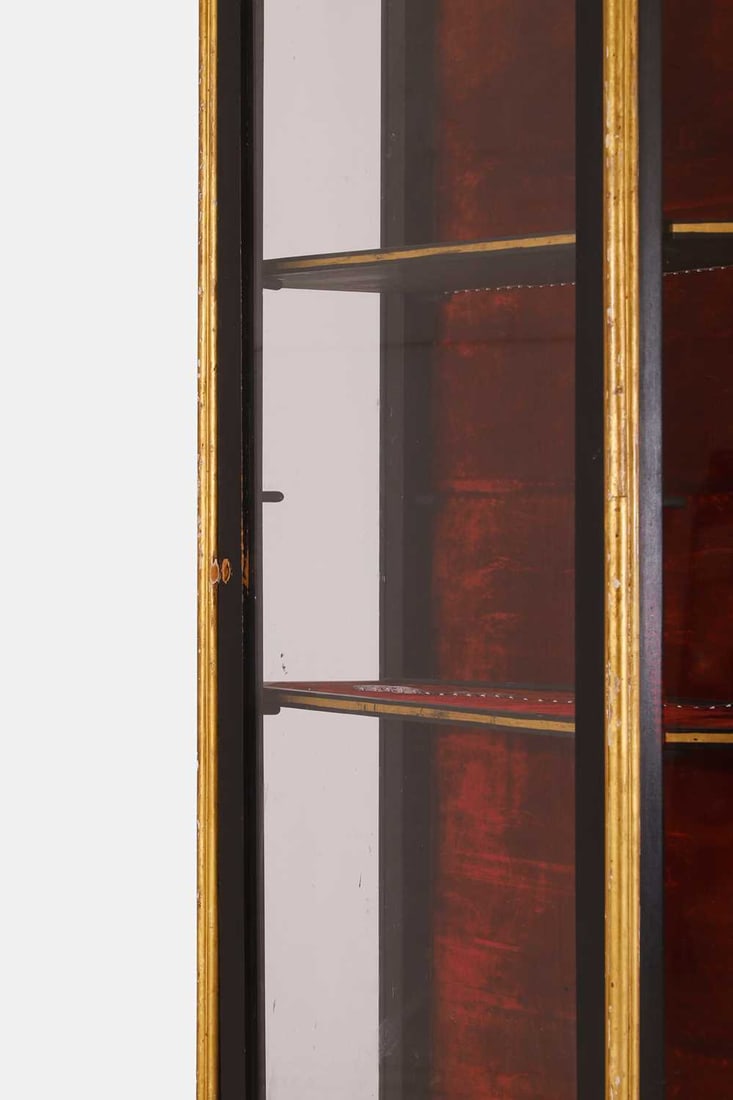 A Napoleon III-style parcel-gilt ebonised vitrine, 20th century, - 2