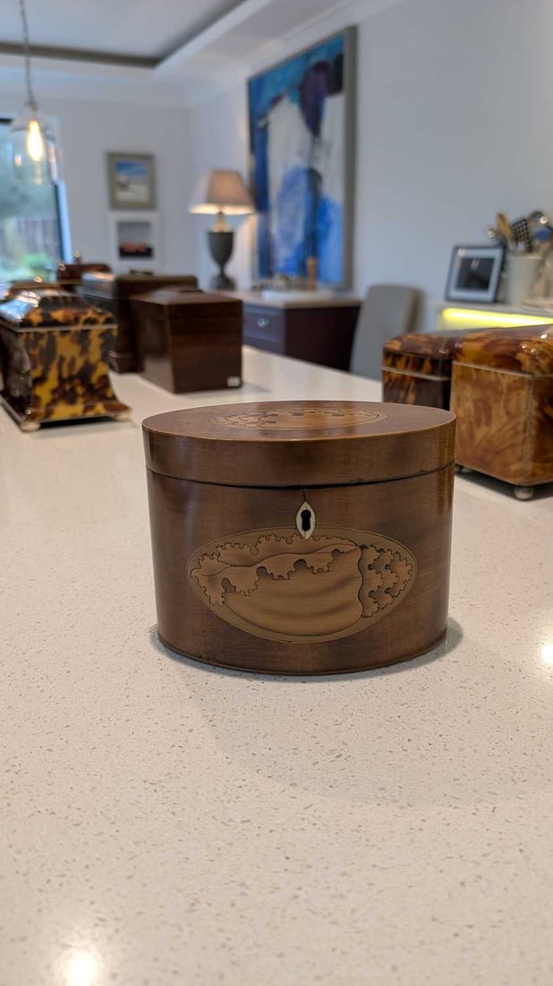 An oval mahogany tea caddy, - 2