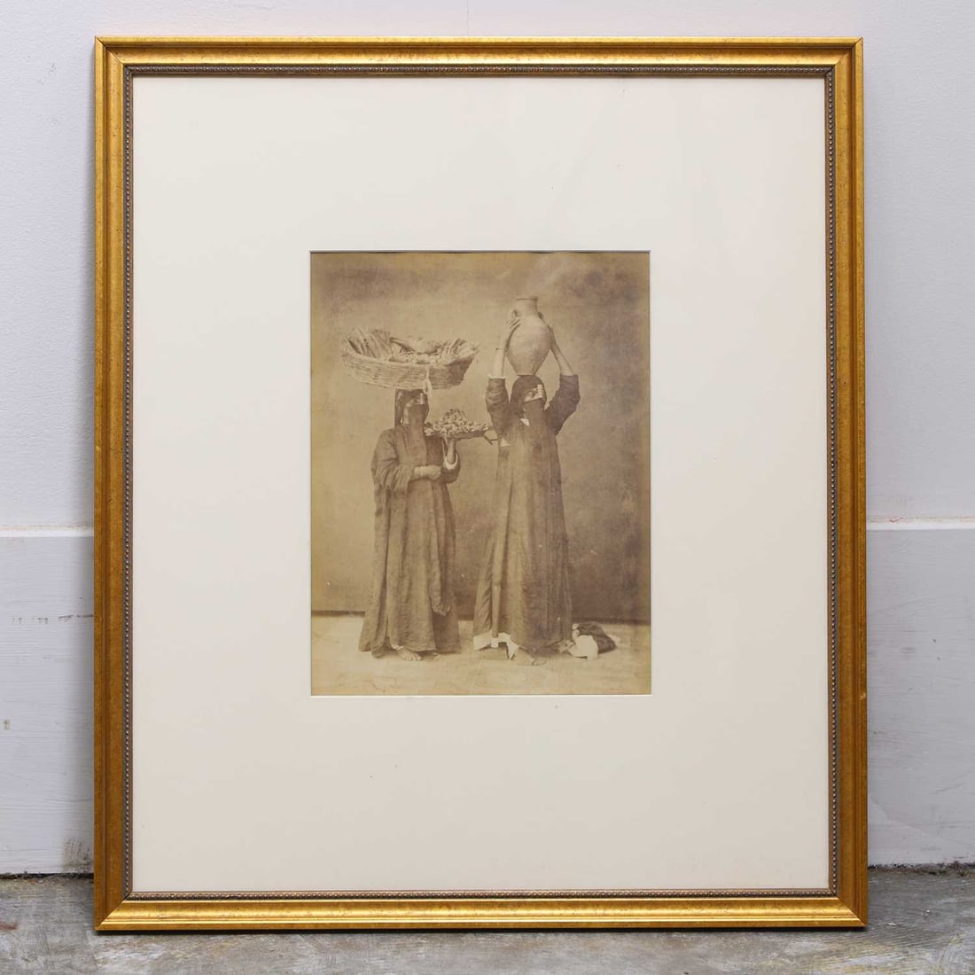 Félix Bonfils (French, 1831-1885): Félix Bonfils (French, 1831-1885) 'Marchande de fruit et porteure d'eau au Caire' (Fruit seller and water carrier of Cairo) albumen print 25.5 x 19.5cm; overall 52 x 45cm Provenance: The