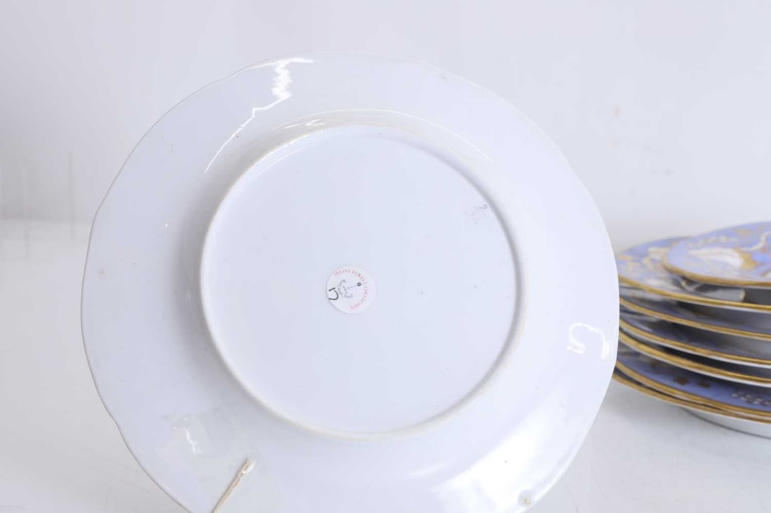 A set of eight painted and gilt-heightened porcelain dessert plates by Ridgeway, late 19th century, - 2