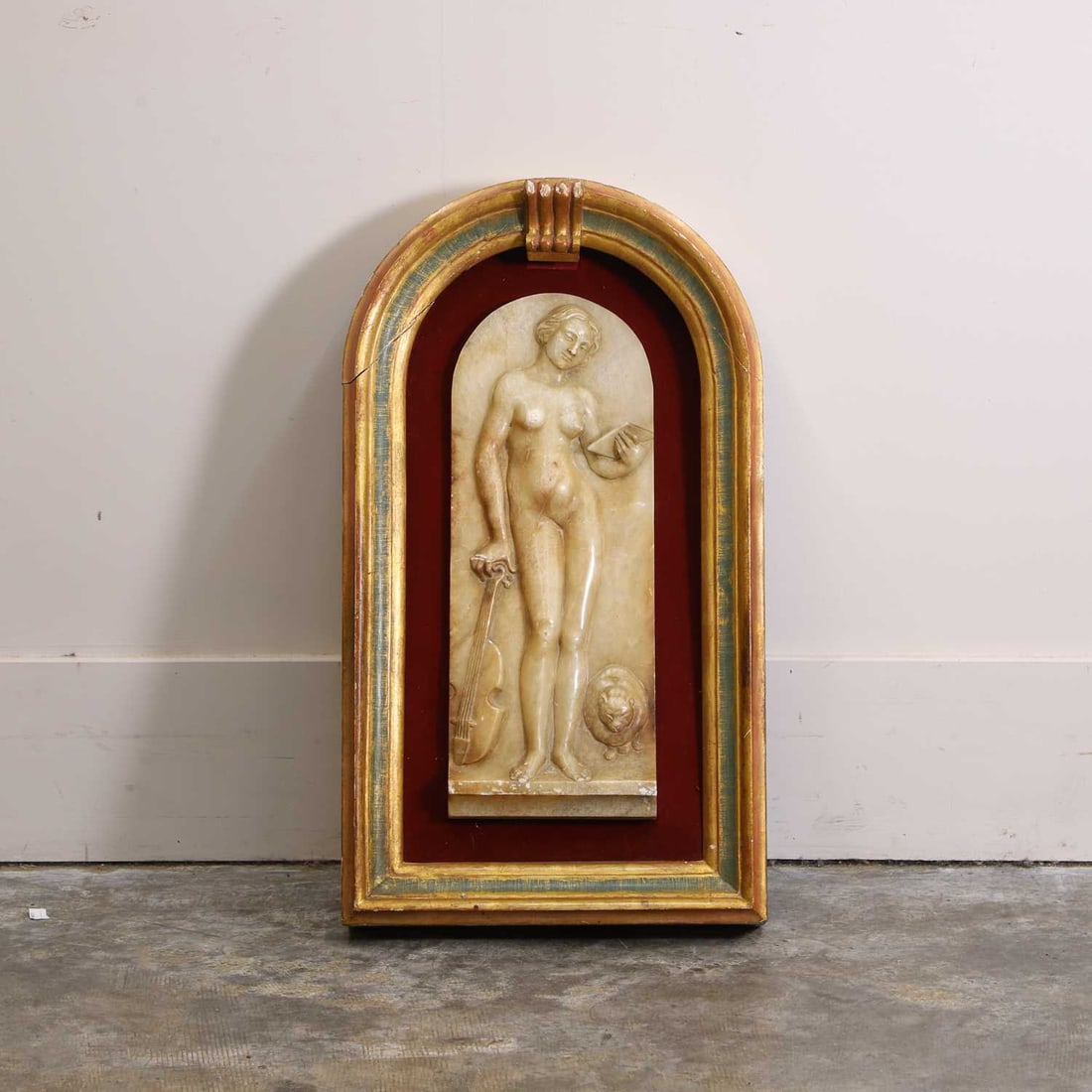 A carved alabaster relief panel, 20th century, (1 of 2)