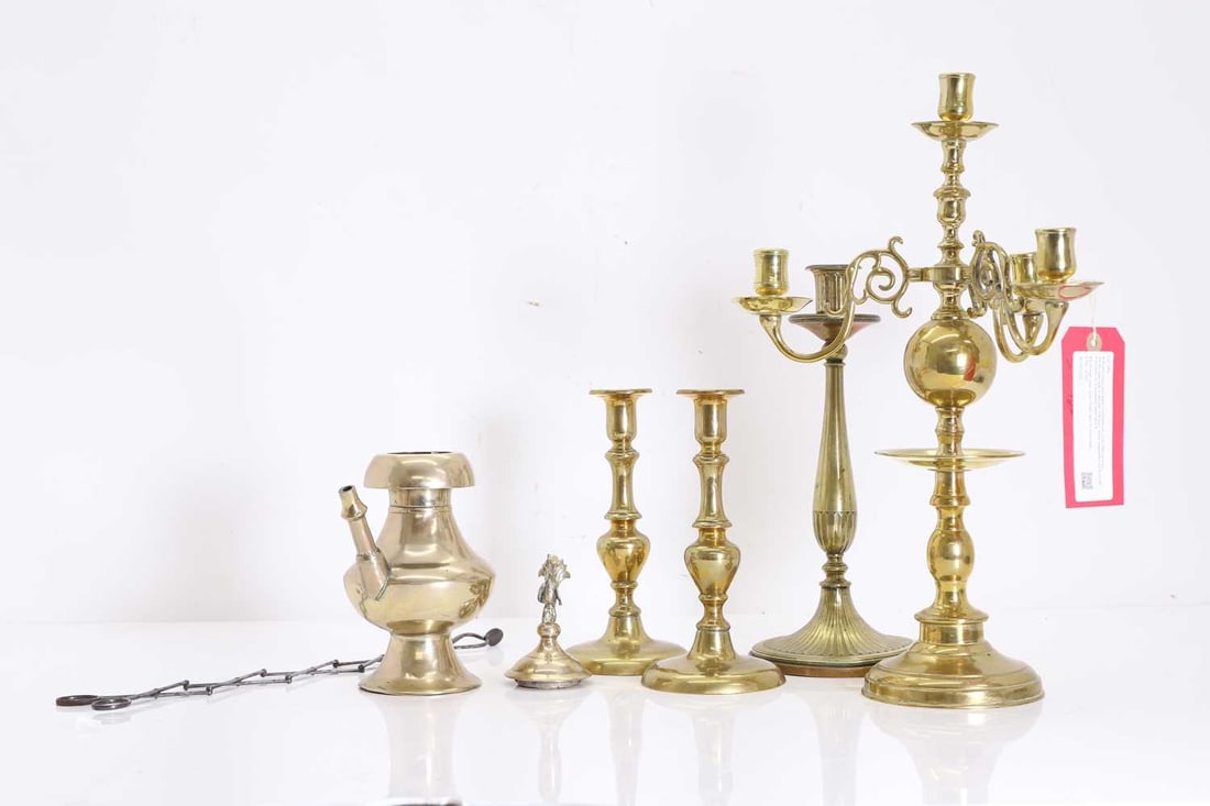 A Dutch brass four-light candelabrum, mid 19th century,: A Dutch brass four-light candelabrum, mid 19th century, the sockets with a circular drip pan, three supported on S-scroll branches on a knopped stem and a circular foot, together with a pair of
