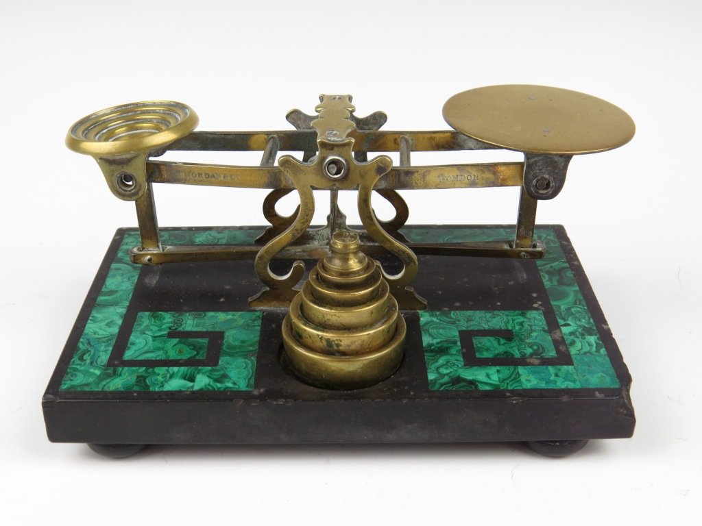 Sampson Mordan & Co., a set of brass postal scales upo: Sampson Mordan & Co., a set of brass postal scales upon an inlaid black slate and malachite base, c.1850-1870, the beams stamped 'S. Mordan & Co, London', with six original brass weights, ¼oz - 4oz, 