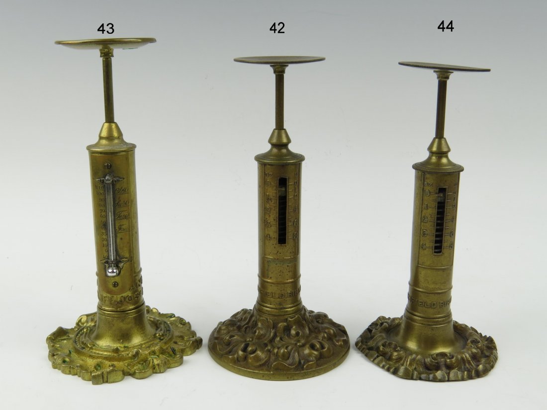 R. W. Winfield, a cast and patinated brass letter scal: R. W. Winfield, a cast and patinated brass letter scale, c.1850, embossed around the pillar base 'R W Winfield, Birmingham', upon an ornate foliate decorated circular base, capacity 4oz, 16cm R W Winf