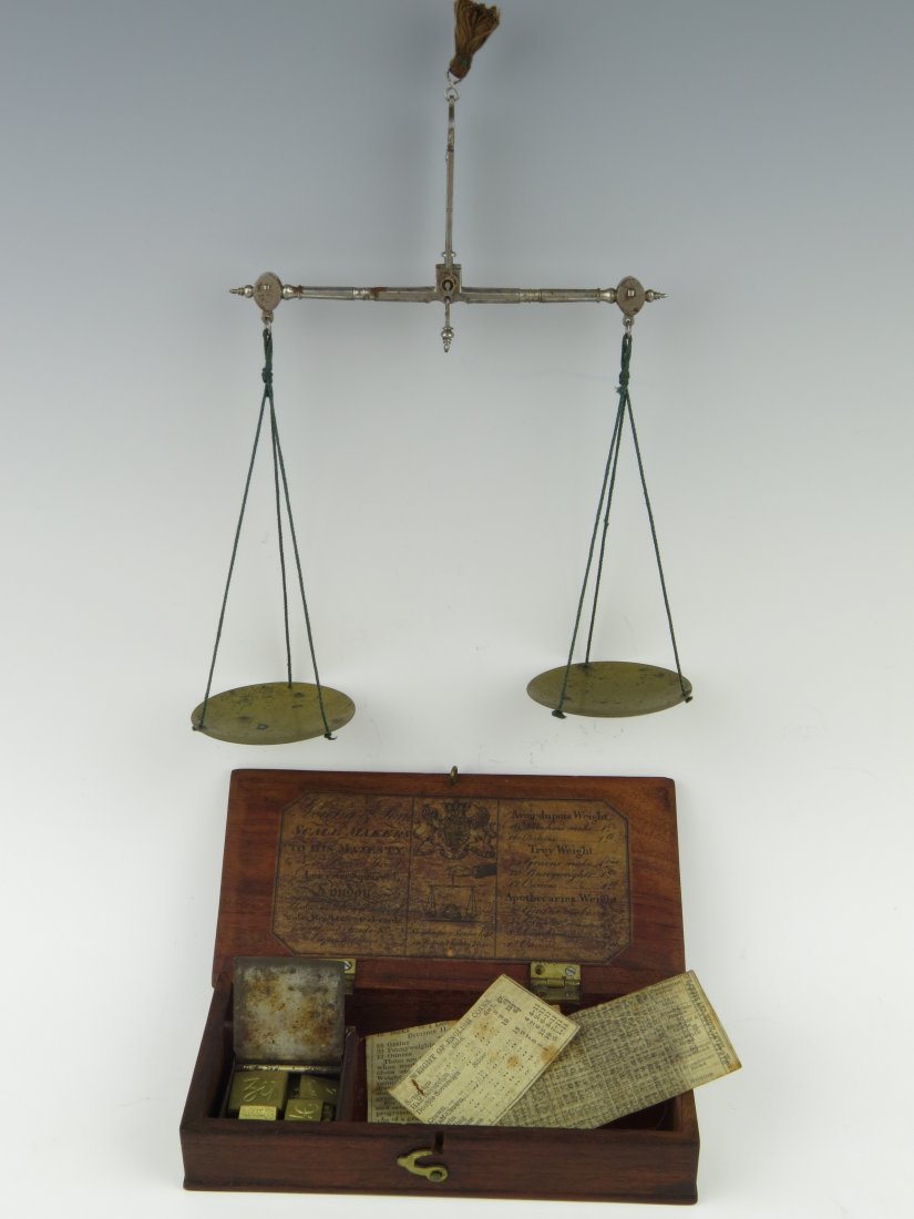 Young & Son, coin scales, early 19th century, the beam: Young & Son, coin scales, early 19th century, the beam with box end terminals, within a mahogany case with trade label to the lid for 'Young & Son, Scale Makers to His Majesty, No.5 Bear Street, Leice
